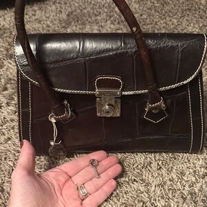 Vintage dooney bag with key. Approx 9 inches Elegant Brown Leather Handbag